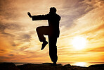 Beach, silhouette and karate man at sunset in Canada for peace, focus and training for competition. Balance, exercise and fitness of professional martial arts athlete at ocean with dusk sun.
