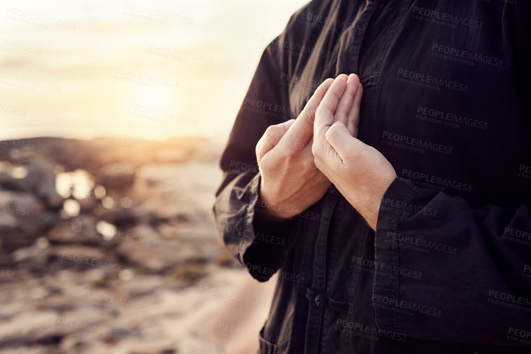 Buy stock photo Man, hands or tai chi on sunset beach for relax exercise, workout or training for mental health, chakra balance or mind wellness. Zoom, person or martial arts by sea, ocean or nature water at sunrise