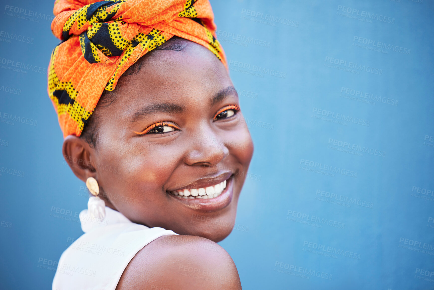 Buy stock photo Black woman, face portrait and happy smile with makeup, beauty and fashion scarf on her head with blue wall background. Young female with natural cosmetics, happiness or smiling outdoor with mockup