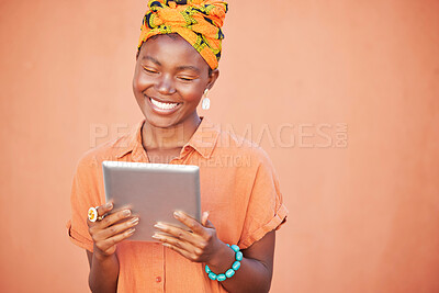 Buy stock photo Face, tablet and black woman on social media in studio on an orange mockup background. Tech, smile and happy female from Nigeria streaming video, movie or internet browsing on digital touchscreen.