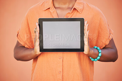 Buy stock photo Marketing, advertising and woman with mockup tablet in hands, cropped on studio background with space for product placement. Digital Marketing, blank screen and orange campaign for web advertisement.