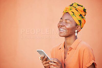 Buy stock photo Face, phone and black woman on social media in studio, texting or internet browsing on an orange mockup background. Comic, smile and happy female with mobile smartphone laughing at funny joke or meme