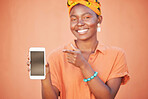 Mockup, black woman and blank smartphone screen for marketing, advertising and against brown studio background. Female, Jamaican lady and phone for social media, search internet and online website.
