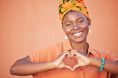 Buy stock photo Portrait of black woman, heart hands and emoji for love, care and kindness, trust and support on orange background. Happy, smile and girl, finger shape and wellness for self care, peace and happiness