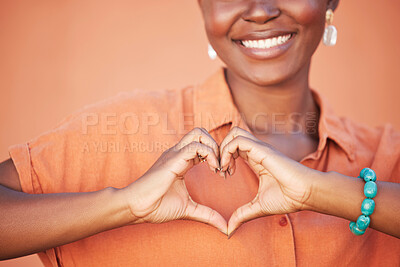Buy stock photo Heart, love and black woman hands for beauty, african self care and fashion cosmetics with peace, happiness and smile with teeth. Summer, orange wall background and happy woman with self love sign