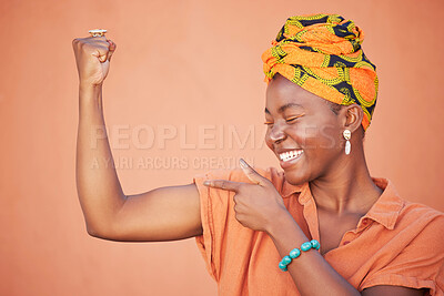 Buy stock photo Power, strong and arm flex with black woman for leadership, gender equality and confident. Muscle, proud and fitness with bicep and fist of girl for success, tough and strength in orange background