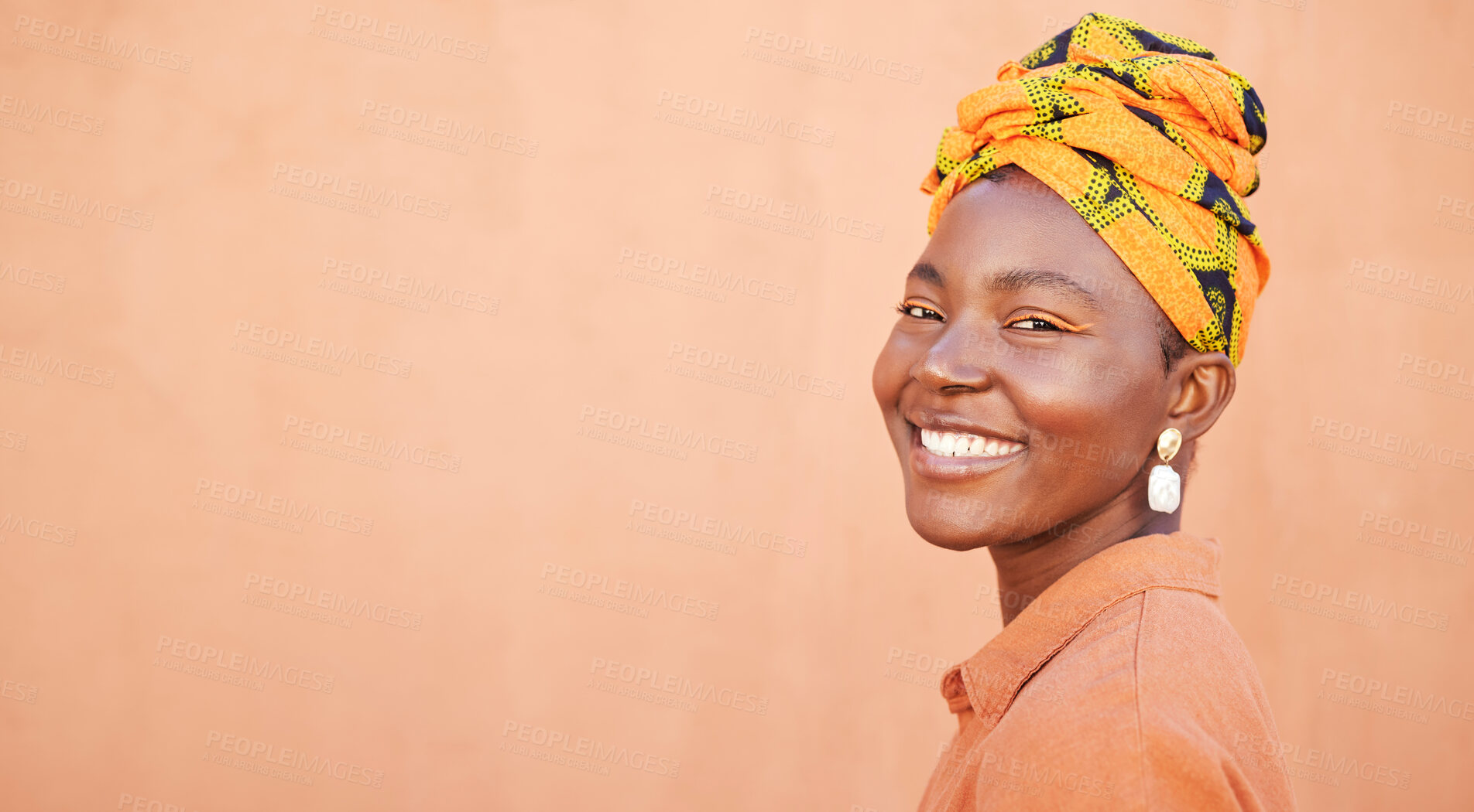 Buy stock photo African, culture and portrait of happy black woman with pride in unique tradition, origin and South Africa heritage. Fashion mock up, head wrap and face of beauty girl isolated on mockup orange wall