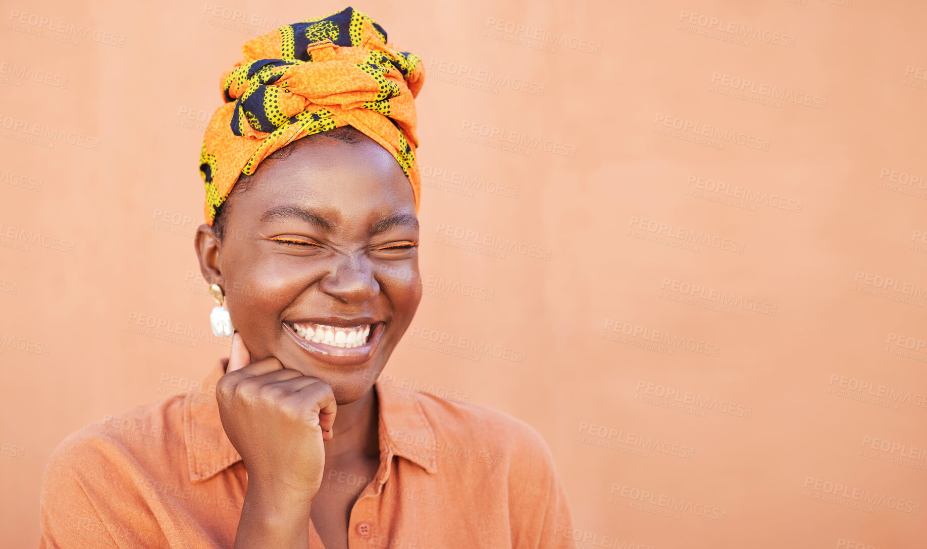 Buy stock photo Black woman, face and smile with a turban and free space for African culture, happiness and beauty mockup on peach background. African female with Nigeria tradition fashion head scarf while laughing