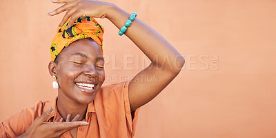 Buy stock photo African, fashion and face of black woman on orange wall background with natural beauty, makeup and smile. Culture, hands and girl in Nigeria with designer jewelry, exotic cosmetics and head scarf