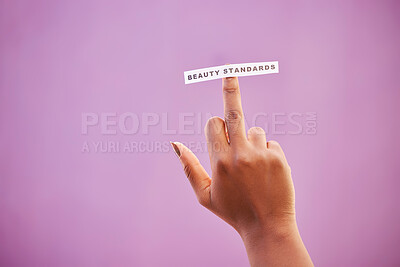 Buy stock photo Woman, middle finger and beauty standards on studio background to protest opinion, society review and stereotype. Mockup, rude hand gesture and sign for anger, revolution and freedom of body ideals