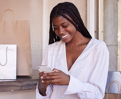 Buy stock photo Black woman, smartphone and shopping, happy and communication, retail and sale with bargain, discount with technology. Phone, shopping bag in mall and social media, text message and mobile app.