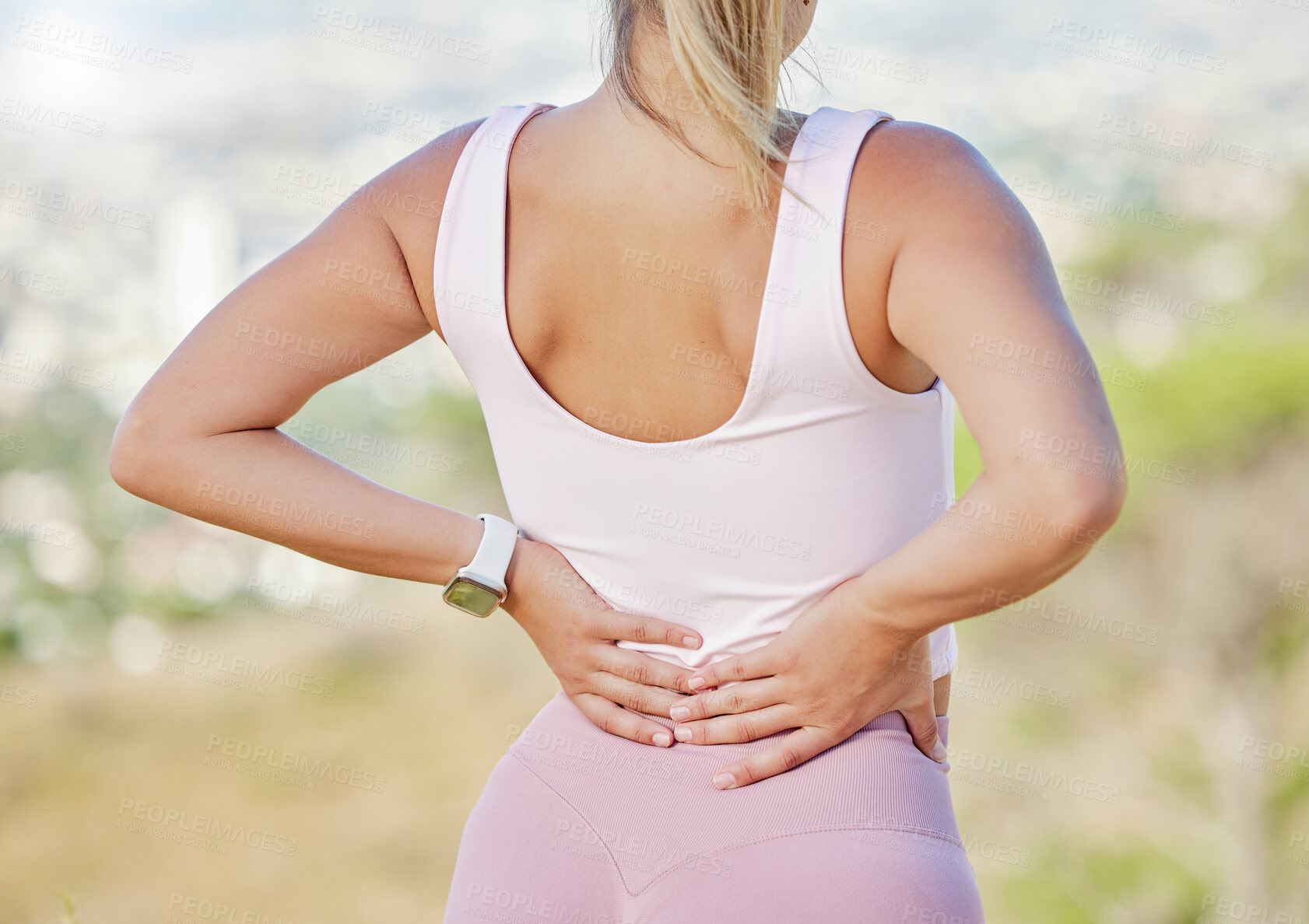 Buy stock photo Back pain, hands and woman exercise outdoor, wellness or muscle tension. Healthy female, athlete and tense rear strain in nature, fitness and workout to relax, injury or training for running or tired