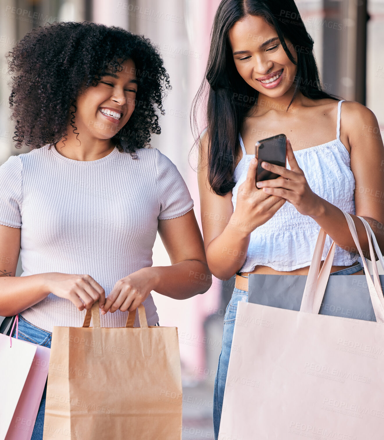 Buy stock photo Woman, friends and phone with shopping bags, smile and enjoying free time or social media together in the city. Happy women smiling in happiness for online sale, deal or discount on mobile smartphone