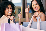 Thumbs up, shopping and friends in the city mall, retail sale and happy with discount. Success, yes and portrait of women with shopping bags for fashion, urban store and win on deal at a shop