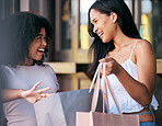 Women, shopping bag and retail promotion conversation in shopping market street for luxury fashion, financial discount and designer product. Friends, shop clothes boutique and happy customer speaking