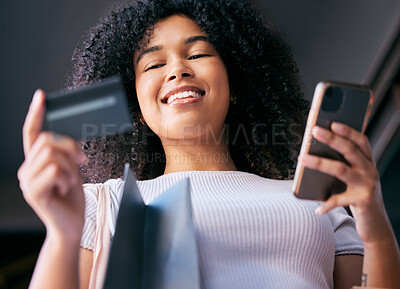 Buy stock photo Black woman, shopping bag and ecommerce credit card for phone purchase with cheerful smile low angle. Payment, 5g and online shopping girl with smartphone for retail app promotion code benefit.
