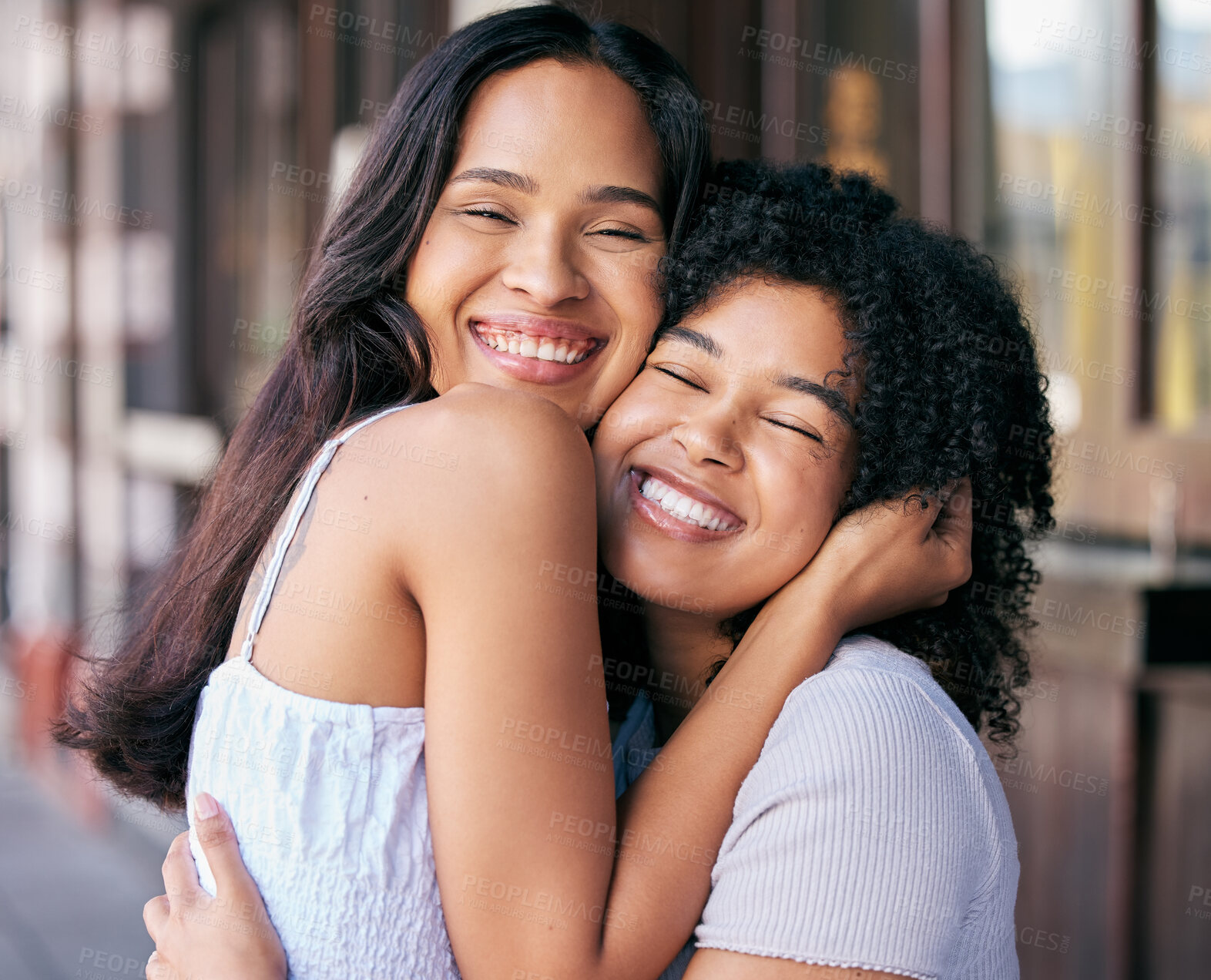 Buy stock photo Friends, love and care with hug while bonding outside in the city during a summer trip. Bond, loving and caring friendship with cheerful women embrace with affection in a positive, happy relationship