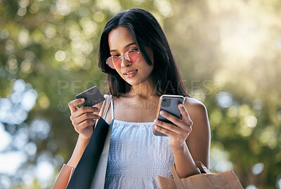 Buy stock photo Woman, credit card and smartphone for ecommerce, outdoor or online shopping bags. Young Latino female, customer or lady shopper with phone, purchase clothes or spending for expensive products or sale