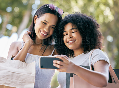 Buy stock photo Selfie, phone and friends shopping in the city for luxury retail discounts, sales or promotions. Happy, smile and women taking a picture together with a cellphone while buying clothes in a urban town
