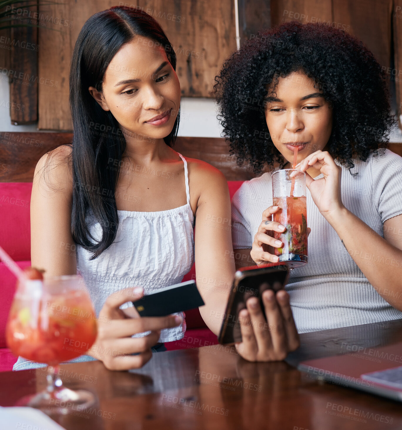 Buy stock photo Woman, friends and phone with credit card drinking at restaurant, bar or cafe making online payment or transaction. Women chilling together having a drink in ecommerce or remote banking on smartphone