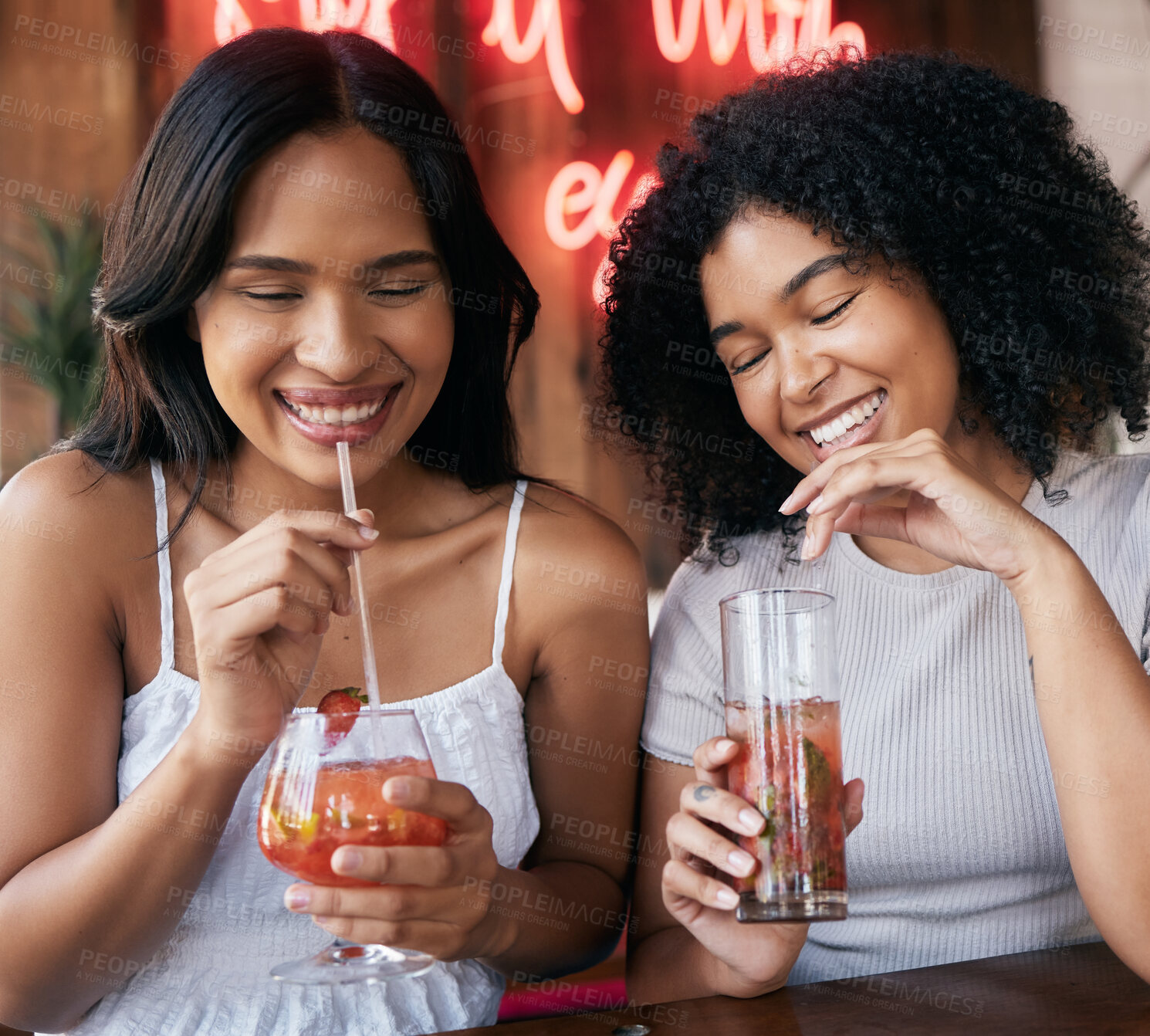 Buy stock photo Cocktail, drink and happy hour with black woman friends drinking in a club or bar together for fun. Cafe, glass and cocktails with a young female and best friend enjoying a beverage while bonding