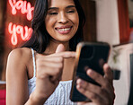 Woman, phone and cafe for texting or browsing online social media for a meme or content in a restaurant. Coffee shop, mobile and social network with a female customer reading a blog on the internet