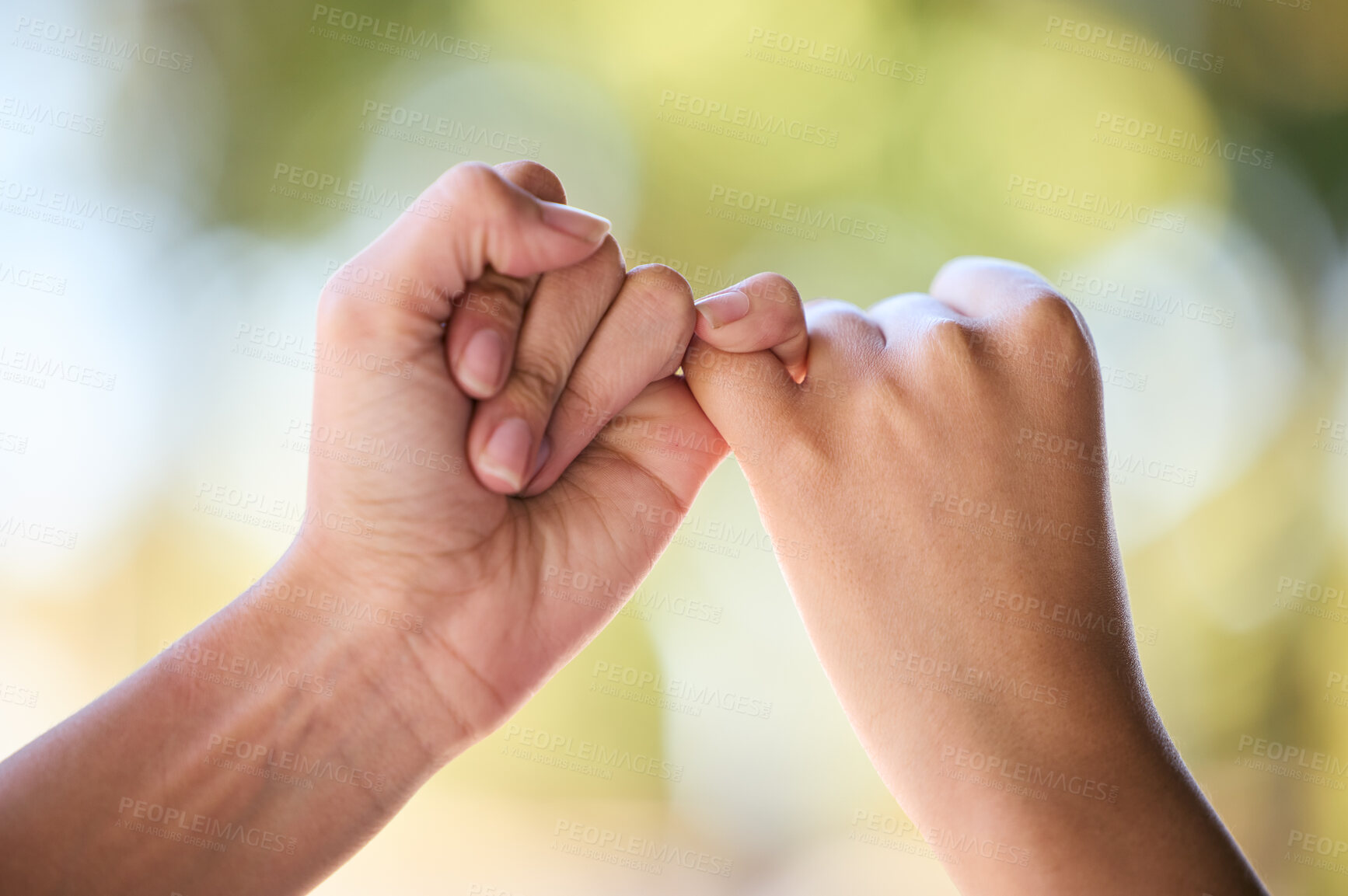 Buy stock photo People, promise and fingers for support, trust and love connection in nature outdoors. Closeup, hands and couple of friends link little finger for hope, respect and commitment, kindness and agreement