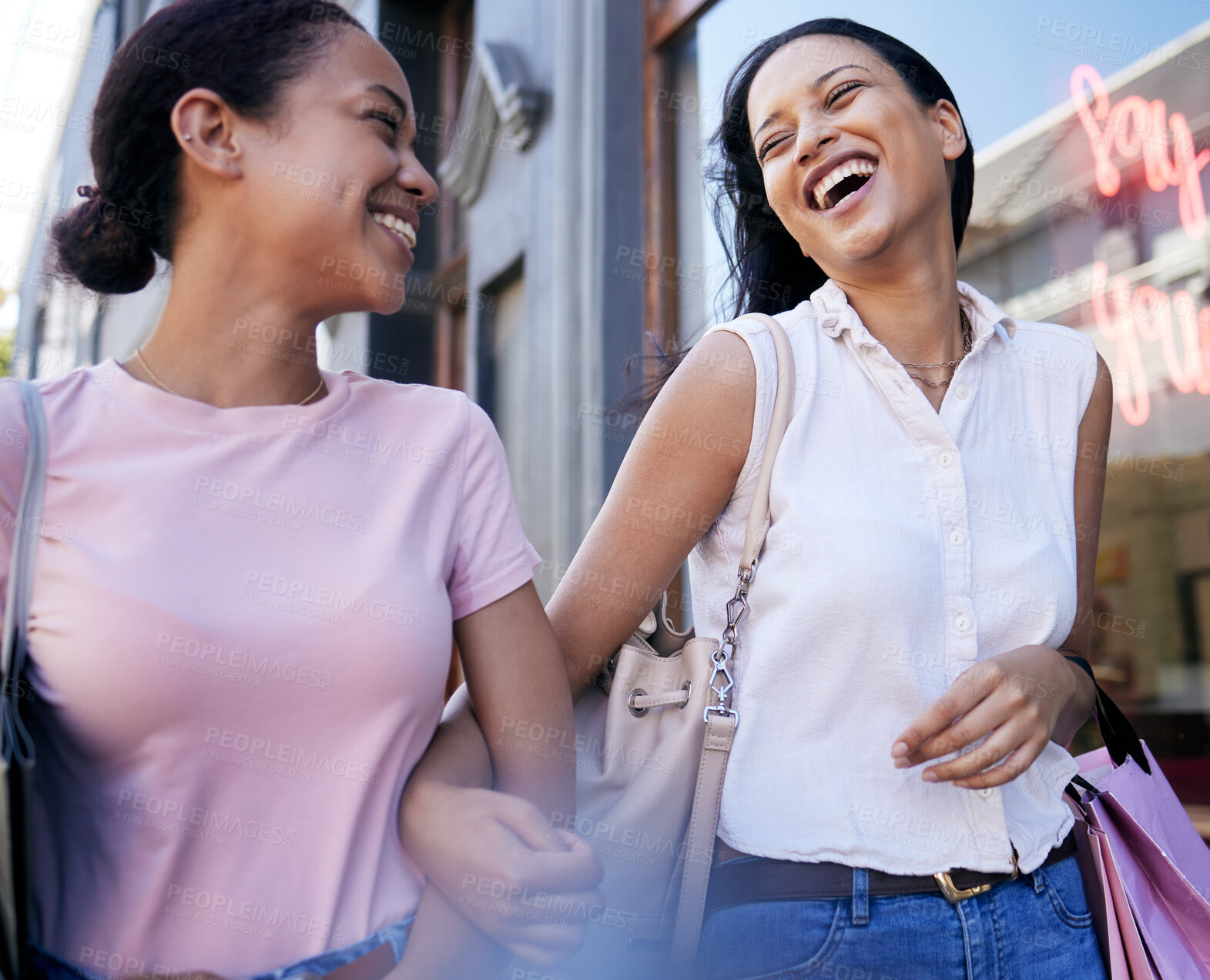 Buy stock photo Women, lesbian couple and shopping while holding hands in city, laughing at joke and bonding. Love, sales or discount deals and girls walking with shopping bags after buying clothing in fashion mall.