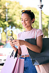 Smartphone, shopping bag and woman in city for fintech application, retail therapy and website discount, sales or promotion code in ecommerce. Happy woman using phone for shopping blog tips in summer