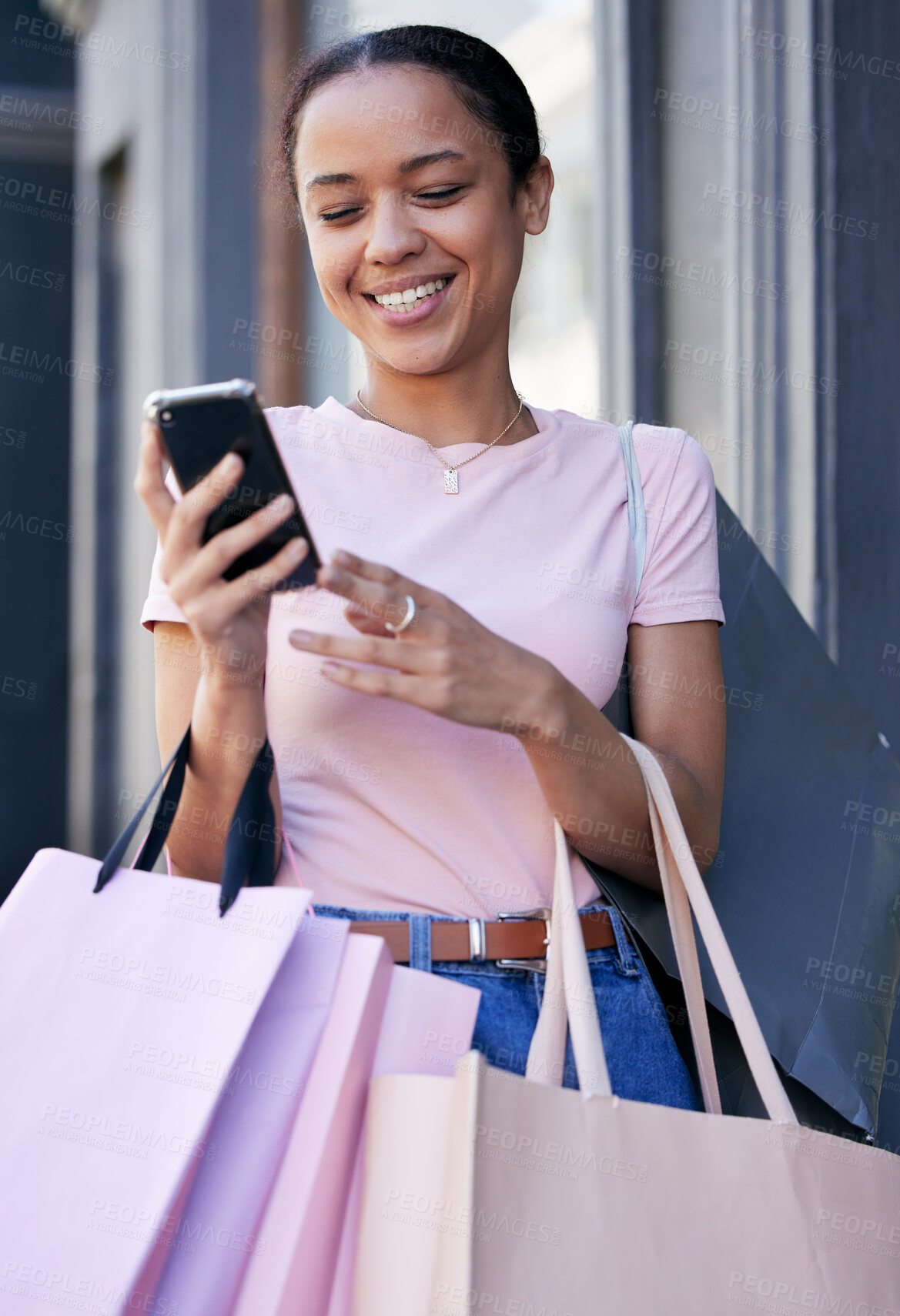 Buy stock photo Shopping, smartphone and black woman with shopping bag at outdoor mall, retail and fashion boutique with technology and communication. Mobile phone, shop and customer, happy and check social media.