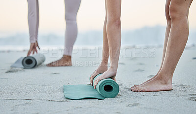 Buy stock photo Fitness, beach and women roll yoga mat getting ready for workout, exercise or stretching. Zen, meditation or hands of females, girls or friends outdoors on beach sand rolling mat for pilates training