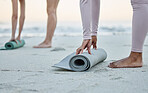 Yoga, mat and beach with a woman athlete on the coast by the sea or ocean for fitness and exercise. Hands, earth and water with a female yogi training on the shore for wellness ot mental health