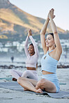 Woman, friends and yoga in meditation on the beach for healthy spiritual wellness, fitness or workout in the outdoors. Happy women relax in warm up stretch, meditating or zen exercise in Cape Town
