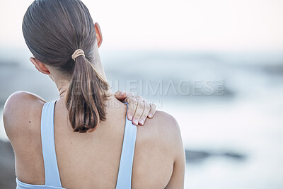 Buy stock photo Back pain, stretching and woman at beach for fitness, body training and muscle accident during exercise in Greece. Warm up, health and girl with hand for pain, injury and workout crisis at the sea