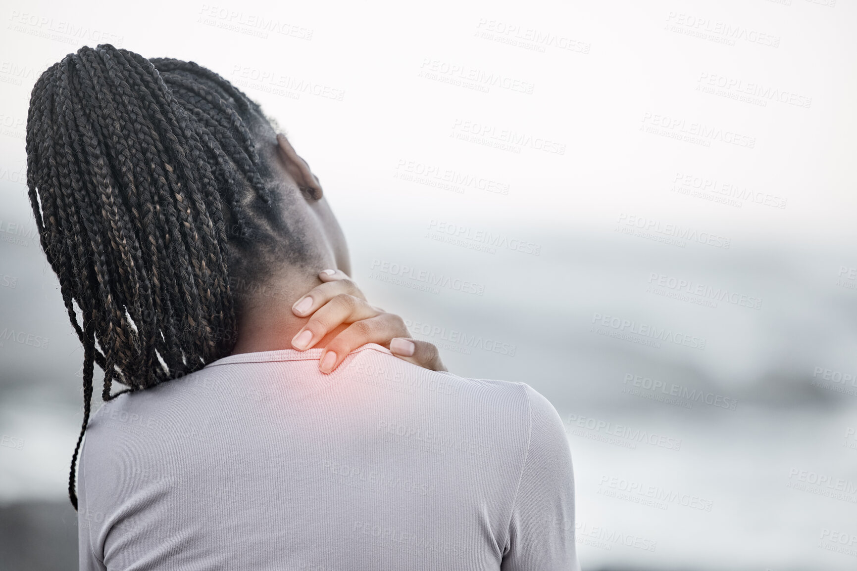 Buy stock photo Black woman, neck and back pain on beach for fitness exercise, body wellness or sports training outdoor. African woman, body injury and shoulder muscle emergency or workout acciedent by ocean sea