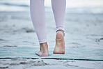 Woman, bare feet and beach yoga exercise, workout and stretching ankle on sand for zen energy, healthy lifestyle or body wellness. Closeup, foot and fitness at ocean for pilates, balance and training