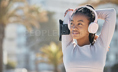 Buy stock photo Black woman, exercise and fitness stretching outdoor and listening to music in nature for energy and cardio workout for health and wellness. Athlete runner with headphone for audio and streaming