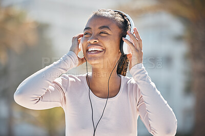 Buy stock photo Happy, fitness or black woman with headphones for a podcast, music or radio streaming for motivation in Miami. Nature, smile or healthy girl runner laughing at a funny audio after training exercise