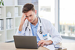 Doctor, laptop and stress headache about bad news or diagnosis for medical professional in his office. Hospital, clinic and male gp specialist reading email and feeling upset with a migraine