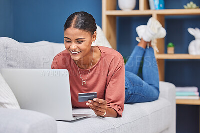 Buy stock photo Credit card, laptop and woman relax on sofa online shopping, ecommerce website and shop fashion sale in living room. Black woman, happy customer and digital tech purchase with bank card or bank app