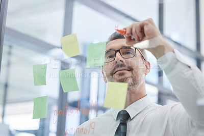 Buy stock photo Vision, sticky notes and man writing idea in corporate office in strategy meeting, planning and brainstorming. Creative thinking, leader and senior businessman with post it on glass wall in workplace
