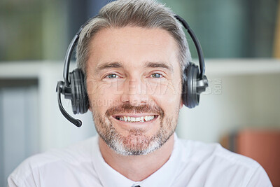 Buy stock photo Call center, customer service and sales with a man consulting using a headset in his sales office. Crm, contact us and telemarketing with a male consultant working in retail support for communication