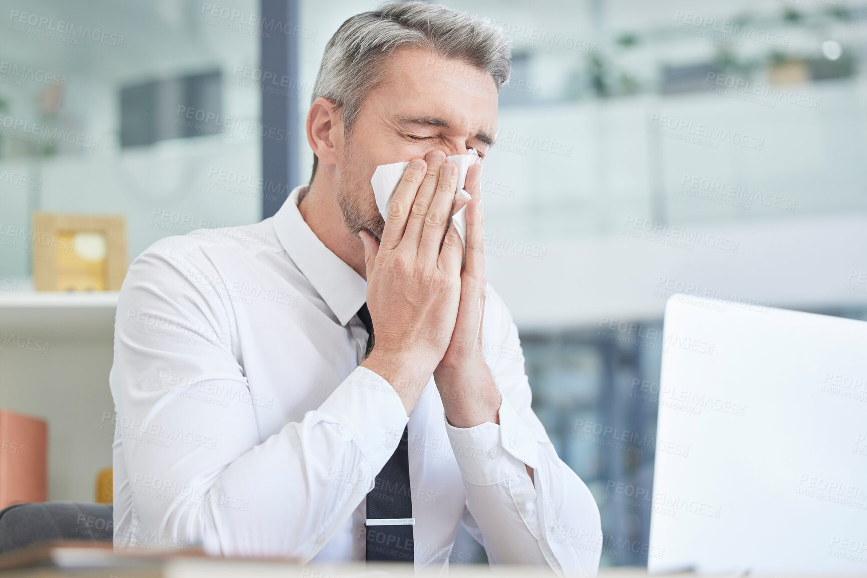 Buy stock photo Allergies, sick and businessman in his office cleaning nose with healthcare risk, workplace compliance policy and management stress. Dust, bacteria and allergy of business or corporate man at a desk