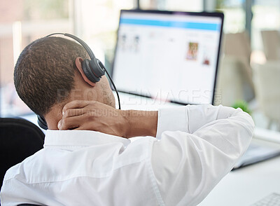 Buy stock photo Call center, advice and neck pain with a man feeling body ache while in a telemarketing and communication job. Burnout, stress and physical strain in a contact us, customer care and consulting agency