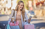 Shopping bag, smartphone and woman in city street with coffee for gift planning, holiday discount and discount deal on e commerce app. Shopping, retail and customer using phone walking in urban road