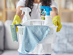 Cleaning, housework and hands of woman with basket, community service and safety from virus in a house. Cleaner job, working housekeeping and girl with product to clean a home in the morning