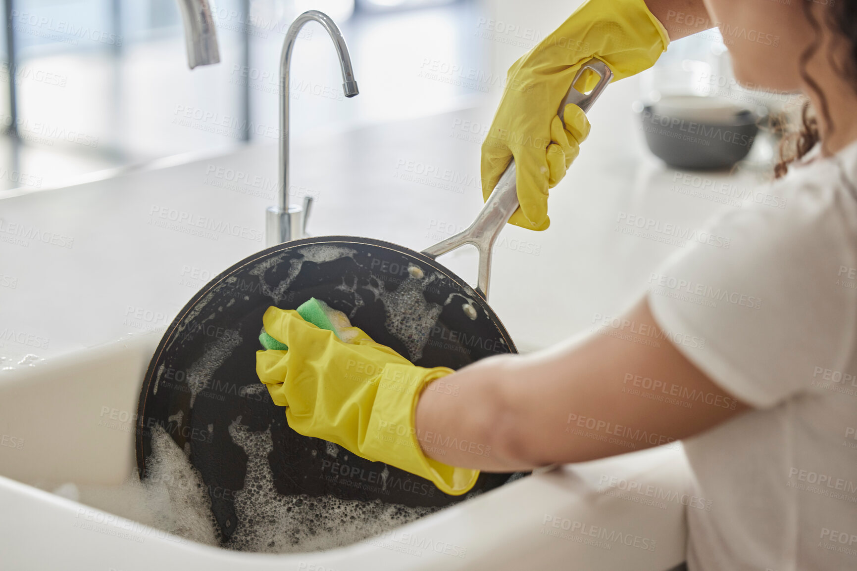 Buy stock photo Cleaning pan, washing and hygiene hands with soap and water in the kitchen sink in home. Zoom of a female hand and bacteria to disinfect, protect and prevent the spread of germs with liquid foam