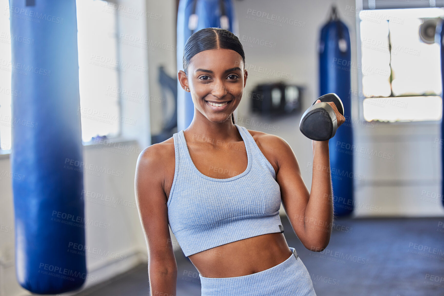 Buy stock photo Happy woman, fitness and dumbbell exercise in gym for strong body, wellness and healthy lifestyle goals. Portrait of indian female, sports and happiness with weights for workout, training and power 