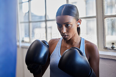 Buy stock photo Boxing, fitness and Indian woman in gym for training, exercise and kickboxing lesson. Sports, wellness and female athlete with boxing gloves for focus, determination and motivation for strong muscles