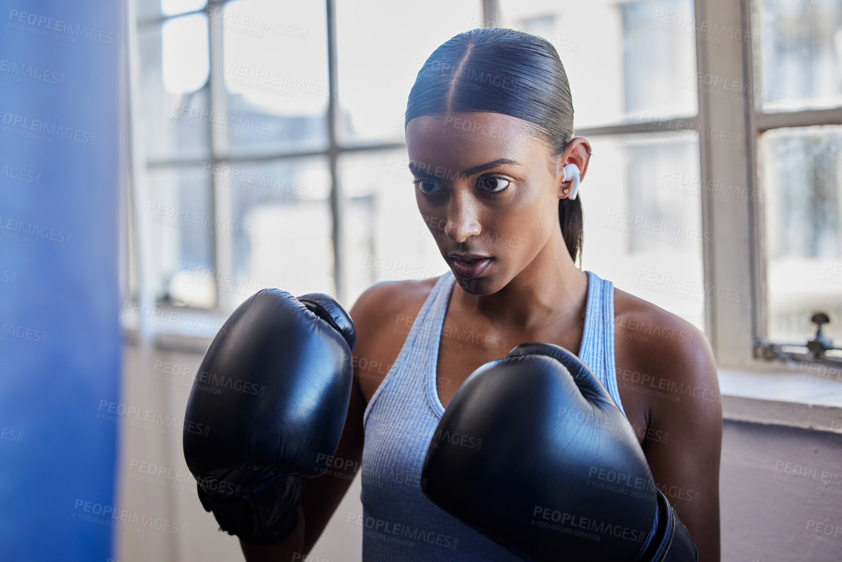 Buy stock photo Boxing, fitness and Indian woman in gym for training, exercise and kickboxing lesson. Sports, wellness and female athlete with boxing gloves for focus, determination and motivation for strong muscles